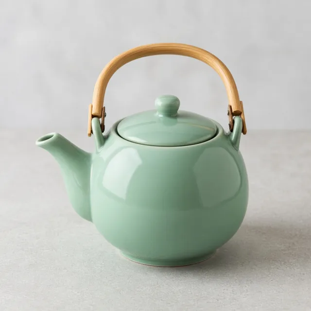 Unbranded mint green ceramic teapot with a bamboo handle